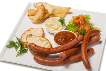 Spicy smoked sausage with cheese and fry potatoes in a pan.