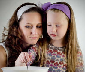 Smiling mother and daughter  together