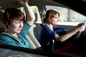 two women bracing for a car crash accident