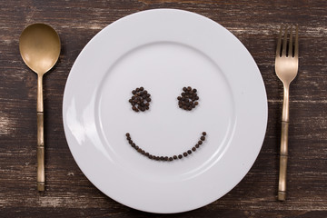 Happy smiley face on dish plate