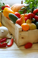 Vegetables and fruits in a wooden crate