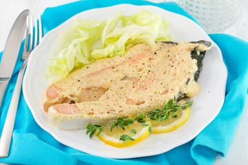 salmon with salad on plate