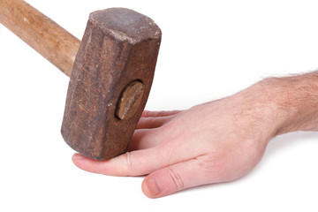 Safety Directions. Sledgehammer hit the fingers of a man © FomaA