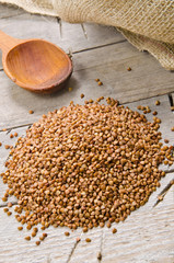 buckwheat groats and wooden spoon