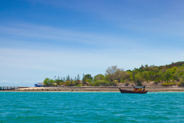 Small fishing boat moored.