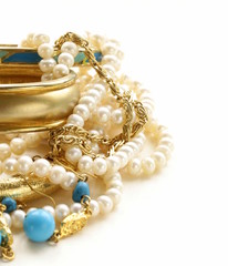 gold, turquoise jewelry and pearl,  on a white background © Olga Kriger