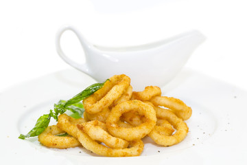 fried calamari rings on a white background