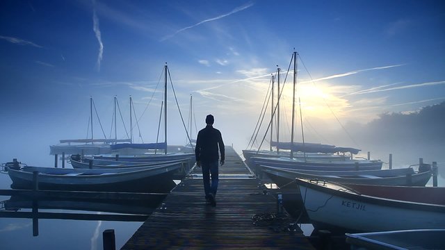 Man walking on a jetty
