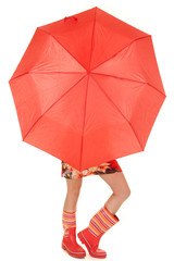 woman legs and boots show under umbrella