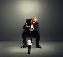 angry boss screaming at small worker