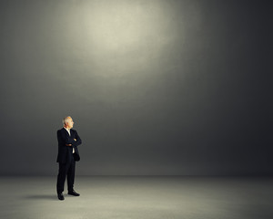 man standing in dark room