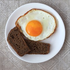 Fried egg and black bread
