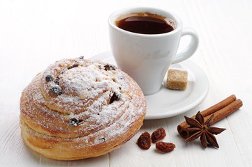 Sweet bun and cup of coffee