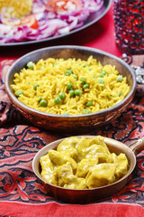 Chicken curry with basmati rice and green peas, dish popular
