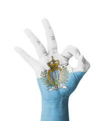 Hand making Ok sign, San Marino flag painted