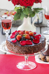 Chocolate cake with strawberries. Birthday party table