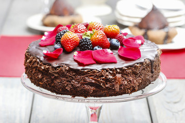 Chocolate cake with strawberries. Birthday party table