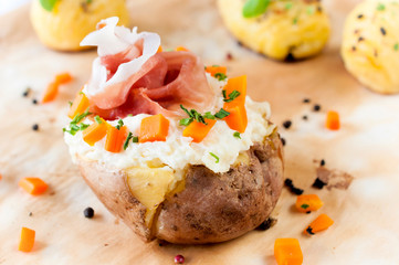 Baked potato and prosciutto