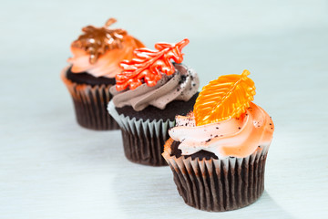 Three Cupcakes With Leaves On Top