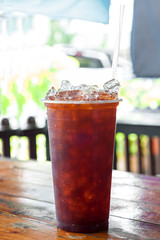 Delicious Ice tea in glass on table .