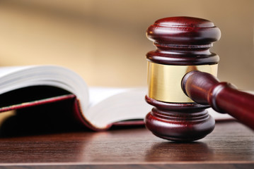 Judges wooden gavel and law book