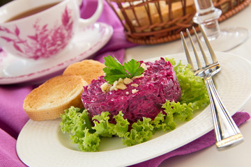 A salad of beets and nuts. Selective focus.