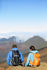 Fototapeta premium Hikers - people hiking sitting enjoying summit top