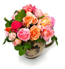 beautiful garden roses in a tea pot