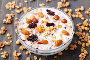 Healthy muesli breakfast with huts and raisin