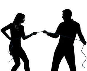 one couple man and woman pulling a rope