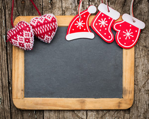 Christmas tree decorations on vintage wooden blackboard