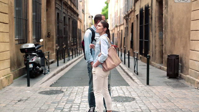 Lost couple looking at map on tablet computer in the city