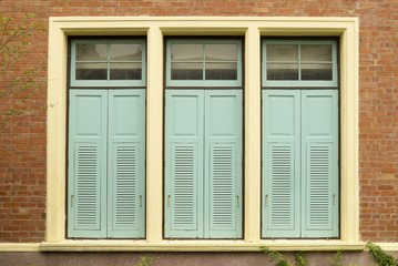 blue shutters in an old wall