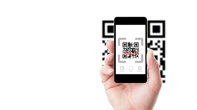 Smartphone in hand scanning QR code