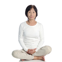 senior asian woman doing meditation in buddhism practice