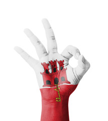 Hand making Ok sign, Gibraltar flag painted
