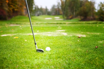 Golf ball before hitting with club from tee