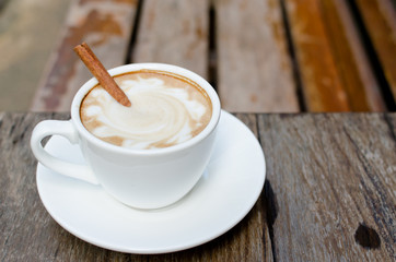 A cup of hot latte with cinnamon