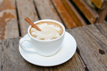A cup of hot latte with cinnamon