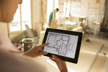 Architect woman working with electronic tablet