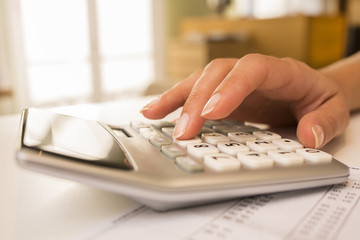 Woman's hands with a calculator, Accounting.