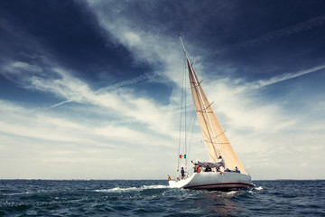 Sailing ship yachts with white sails