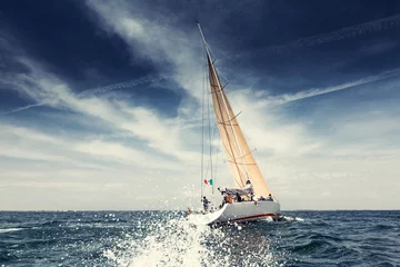 Wandaufkleber Sailing ship yachts with white sails © Andrew Bayda