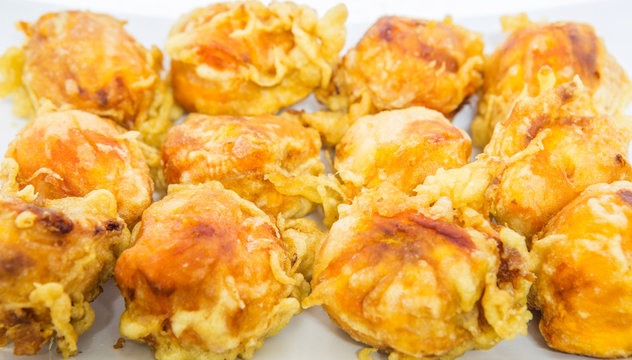 A group of fried chempedak arils.