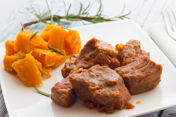 Pork stew garnished with pumpkin