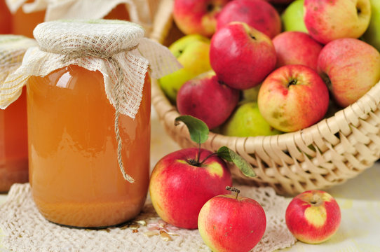 Canned Apple Juice and Apples in Basket
