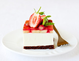 Strawberry and banana jelly mousse cake, selective focus