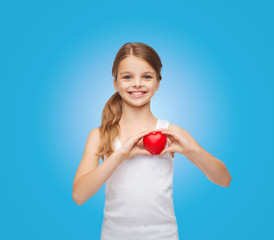 girl in blank white shirt with small red heart