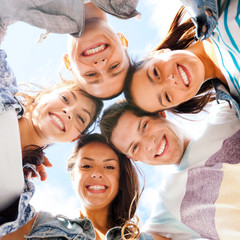 group of teenagers looking down