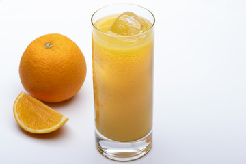 glass of orange juice with ice